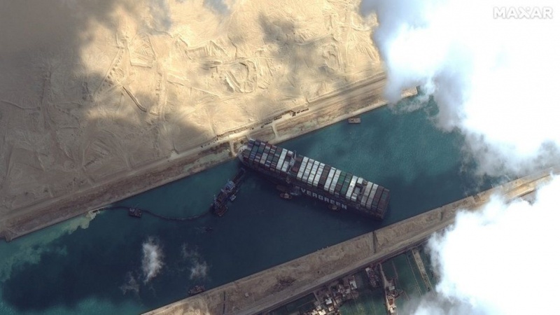 Stranded container ship 'partially refloated', but still stuck in Suez Canal
